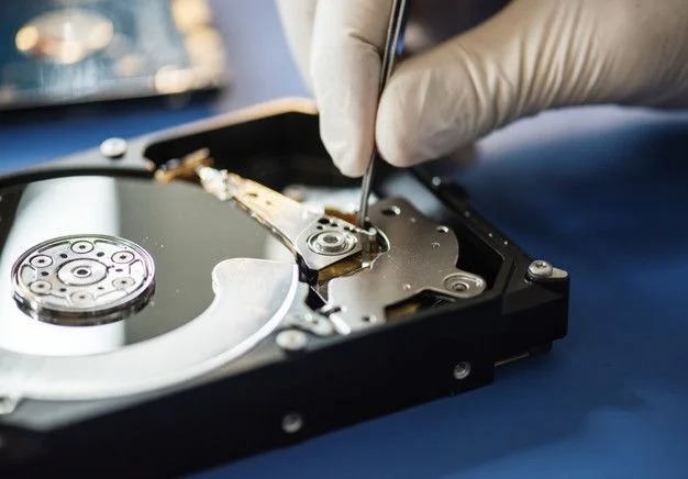 hard drive being repaired by technician